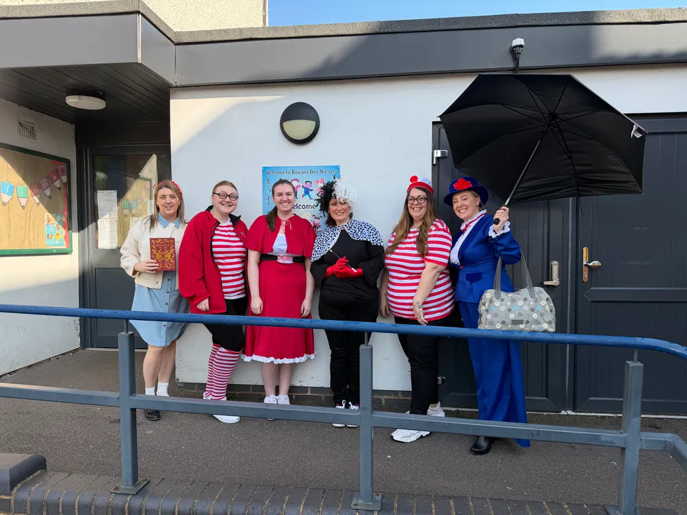 Rowans nursery staff World Book Day costumes in Sutton Coldfield, featuring the team dressed up outside as Mary Poppins, Cruella de Vil, Little Red Riding Hood, Where's Wally, and Miss Honey.